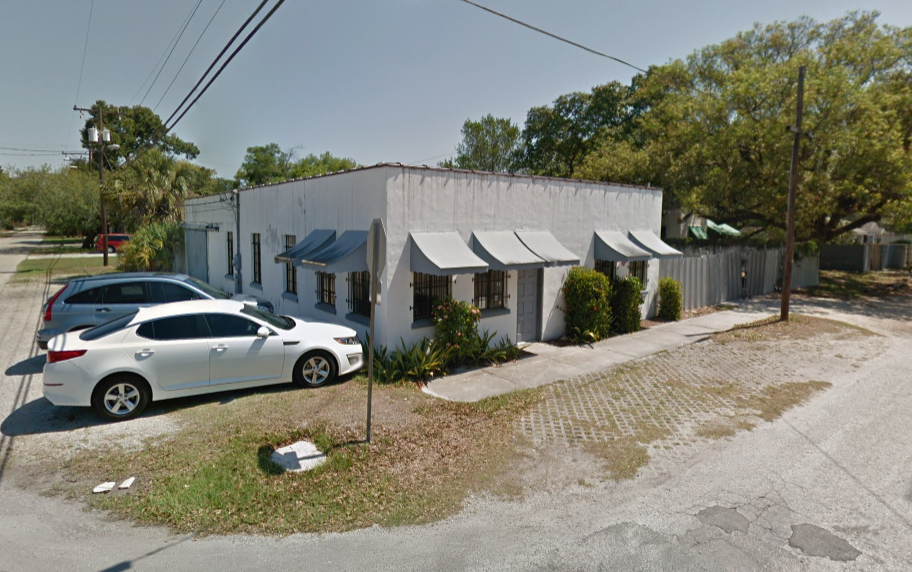 Roofing crew and finished roof work by Tampa Roofing Company